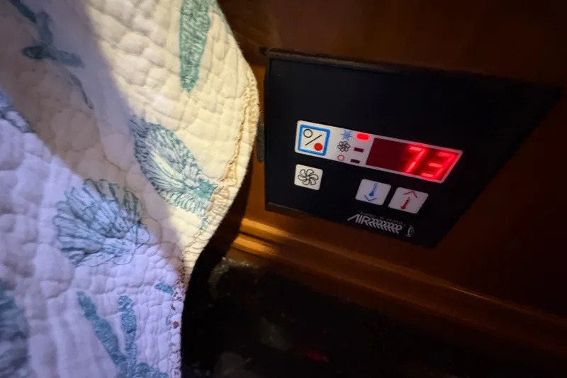 Slide: The Image of Control panel on 2002 Carver 506 Motor Yacht displaying temperature at 73 degrees. - 54