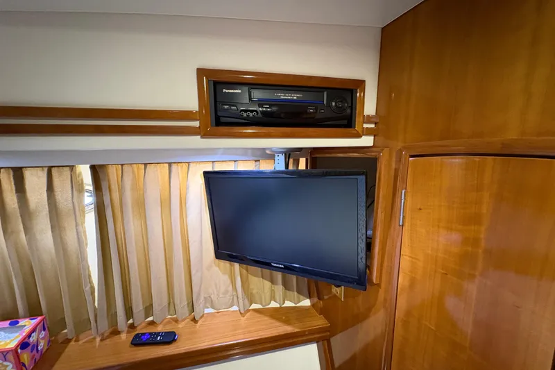 Slide: The Image of Interior of 2002 Carver 506 Motor Yacht with TV and entertainment system. - 55