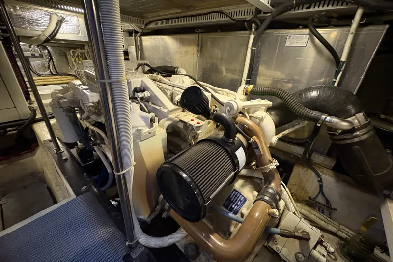 Slide: The Image of Engine room of a 2002 Carver 506 Motor Yacht, showcasing mechanical components. - 67