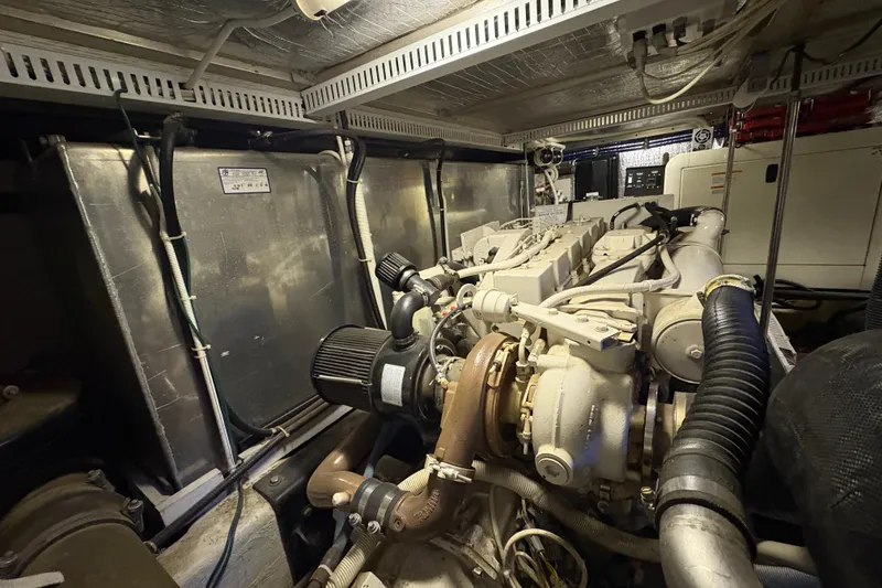 Slide: The Image of Engine room of a 2002 Carver 506 Motor Yacht, showcasing mechanical components. - 68