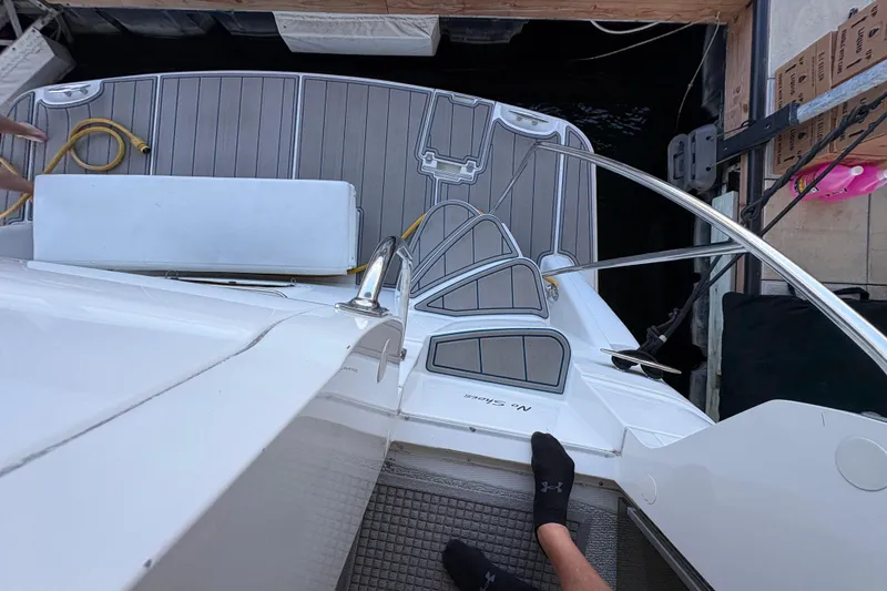 Slide: The Image of 2002 Carver 506 Motor Yacht deck with steps and dock view. - 12