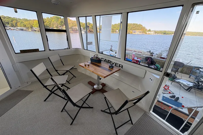 Slide: The Image of Interior of 2002 Carver 506 Motor Yacht with lake view and seating area. - 14
