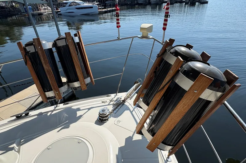 Slide: The Image of 2002 Carver 506 Motor Yacht deck with fender holders, docked at marina. - 20