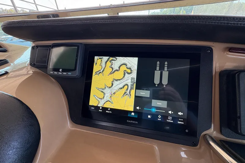 Slide: The Image of Navigation system on 2002 Carver 506 Motor Yacht dashboard with Garmin display. - 25