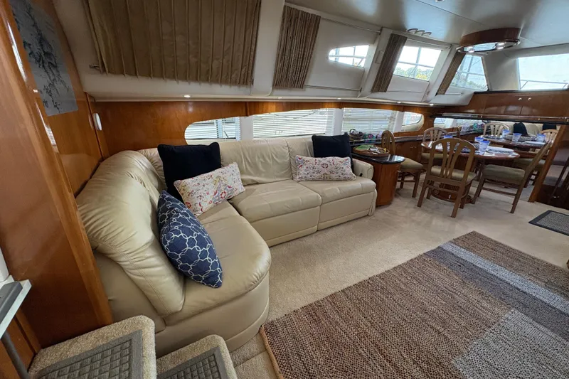 Slide: The Image of Luxurious interior of 2002 Carver 506 Motor Yacht with plush seating and dining area. - 35