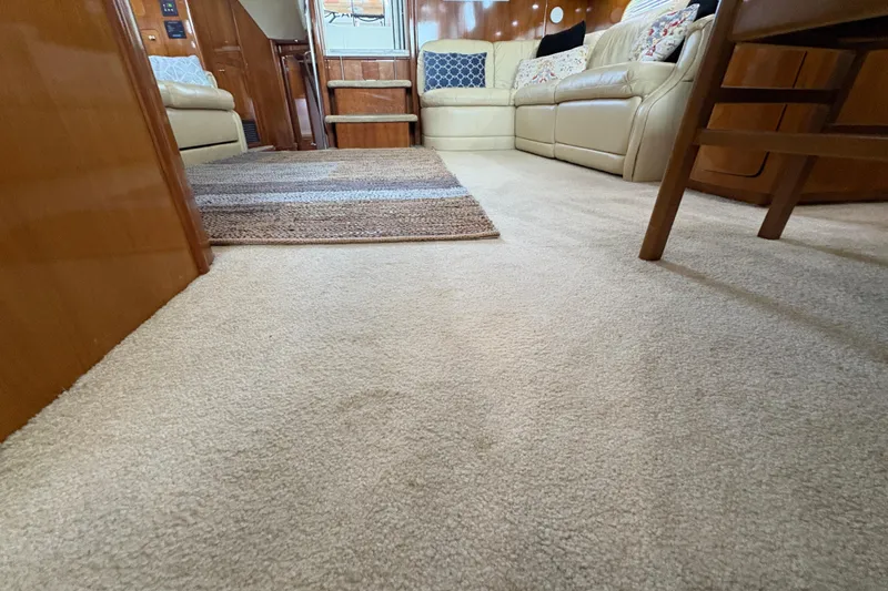 Slide: The Image of Luxurious interior of 2002 Carver 506 Motor Yacht with plush carpet and comfortable seating. - 56