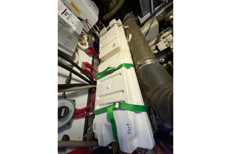 Slide: The Image of Engine room of 2002 Carver 506 Motor Yacht with labeled components and wiring. - 63