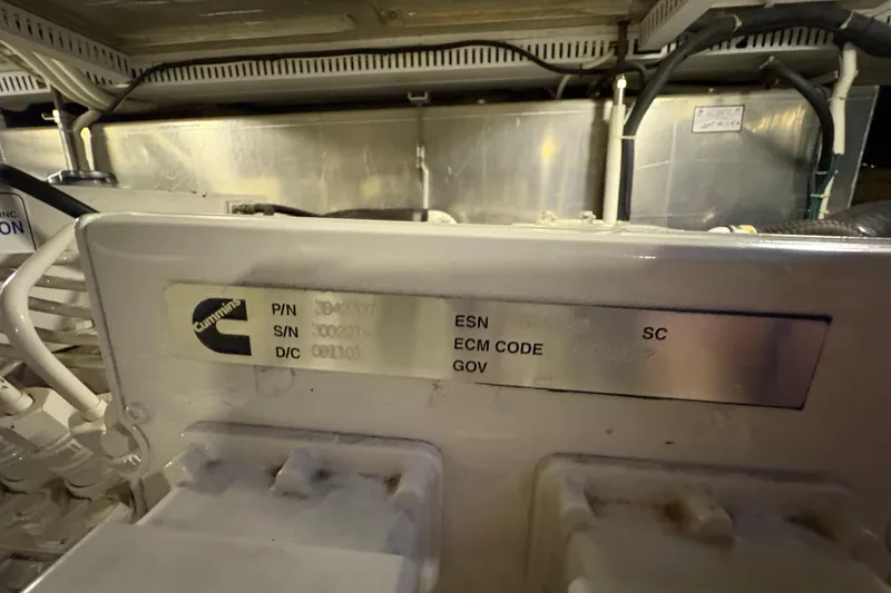 Slide: The Image of Engine compartment of 2002 Carver 506 Motor Yacht with Cummins label visible. - 65