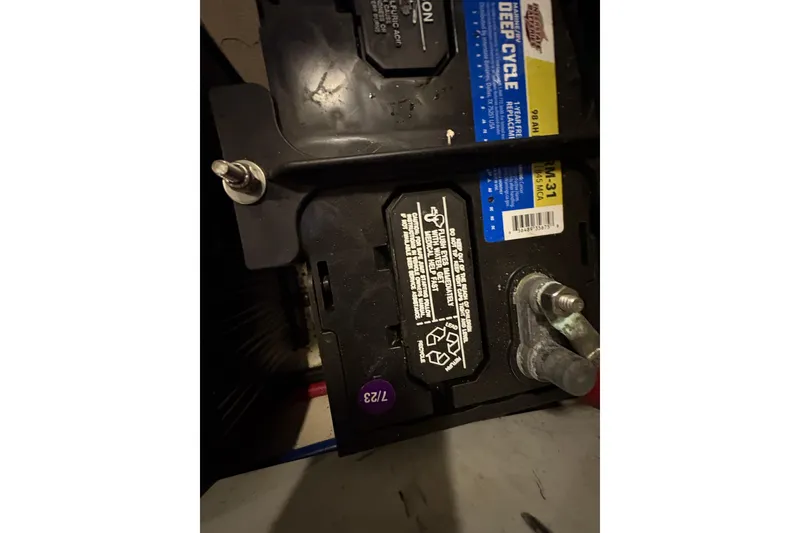 Slide: The Image of Battery compartment of 2002 Carver 506 Motor Yacht, featuring deep cycle battery. - 78