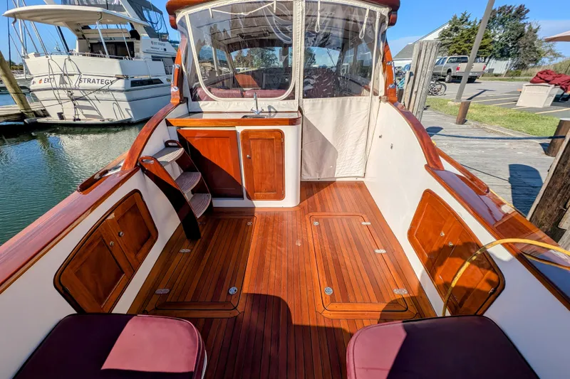 Slide: The Image of Luxurious 2000 Santa Cruz Coastal Flyer 41 boat with polished wood deck and seating. - 12