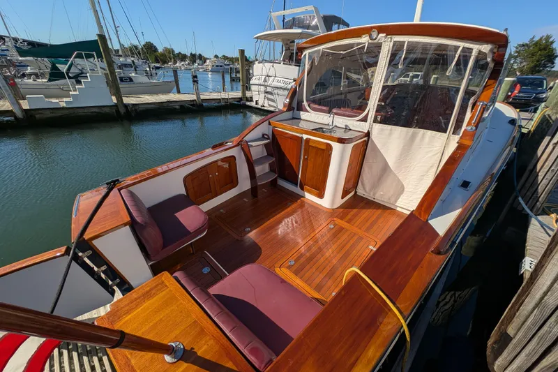 Slide: The Image of Santa Cruz Coastal Flyer 41, 2000 model, docked with polished wood deck and seating. - 17