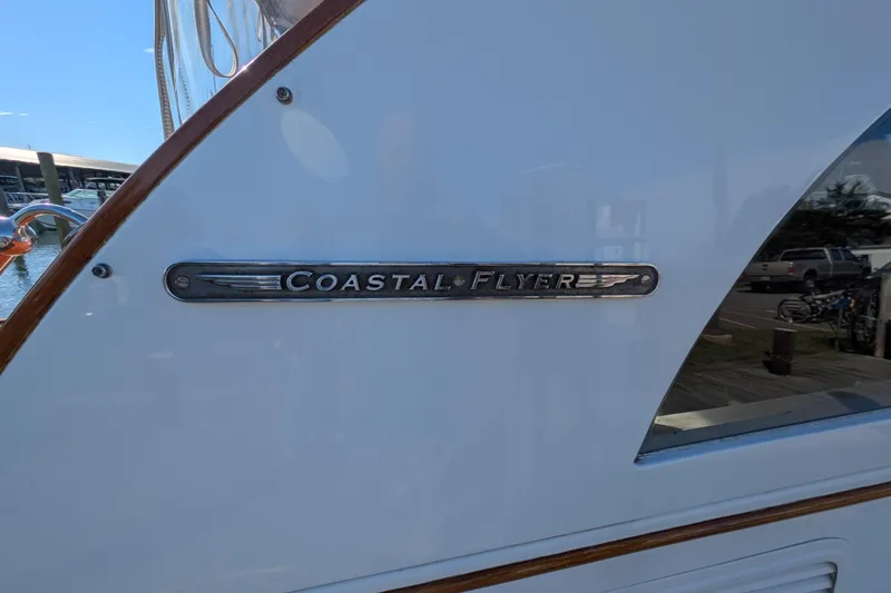 Slide: The Image of Santa Cruz Coastal Flyer 41 boat emblem, 2000 model, docked at marina. - 18