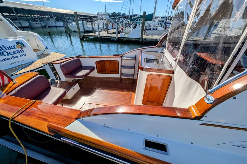 Slide: The Image of 2000 Santa Cruz Coastal Flyer 41 boat with polished wood deck and seating at marina. - 20