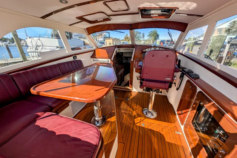 Slide: The Image of Luxurious interior of 2000 Santa Cruz Coastal Flyer 41 boat with polished wood and leather seating. - 21