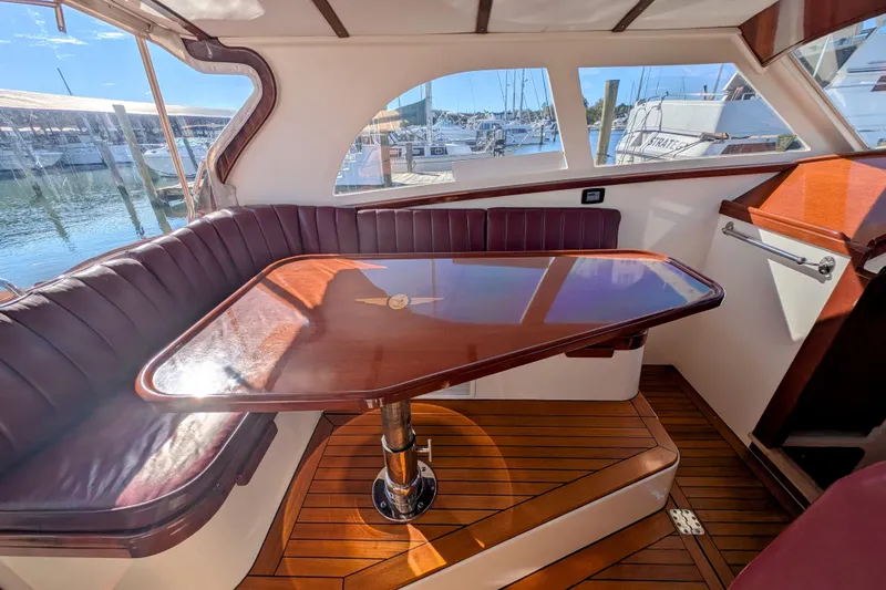 Slide: The Image of Luxurious interior of 2000 Santa Cruz Coastal Flyer 41 yacht with polished wood table. - 22
