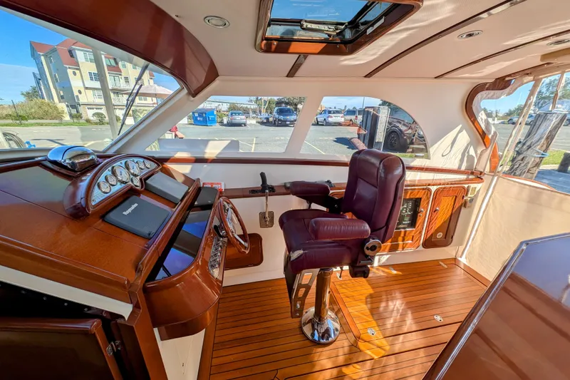 Slide: The Image of Luxurious interior of 2000 Santa Cruz Coastal Flyer 41 with polished wood and leather seating. - 23