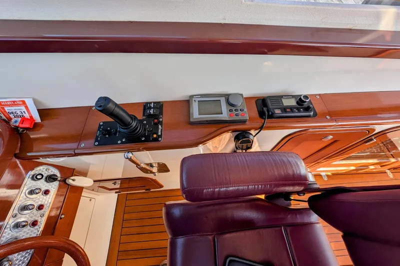 Slide: The Image of Control panel of a 2000 Santa Cruz Coastal Flyer 41 boat with navigation equipment. - 28