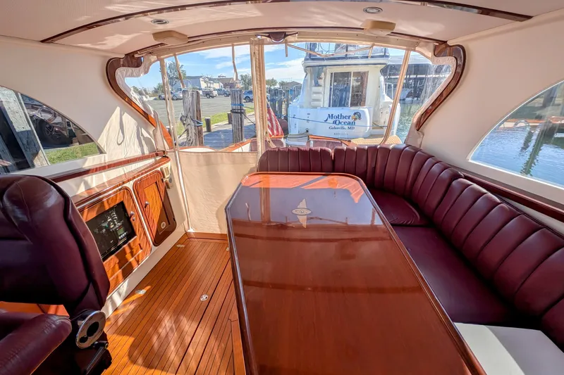 Slide: The Image of Luxurious interior of 2000 Santa Cruz Coastal Flyer 41 yacht with elegant wood finish. - 30