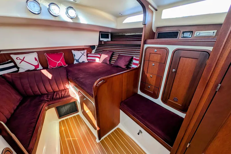 Slide: The Image of Interior of 2000 Santa Cruz Coastal Flyer 41 yacht with plush seating and wooden cabinetry. - 35