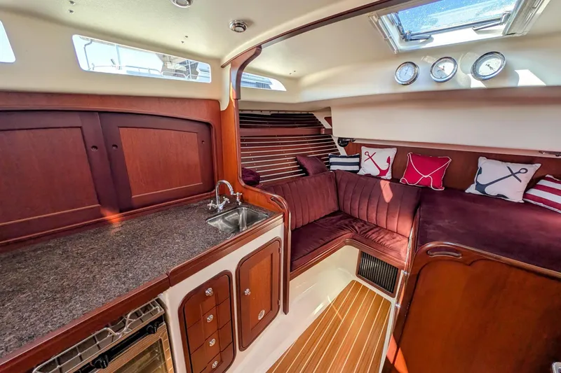 Slide: The Image of Interior of 2000 Santa Cruz Coastal Flyer 41 yacht with cozy seating and nautical decor. - 37