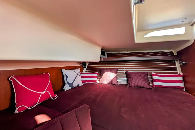 Slide: The Image of Cozy cabin interior of 2000 Santa Cruz Coastal Flyer 41 with decorative pillows. - 39