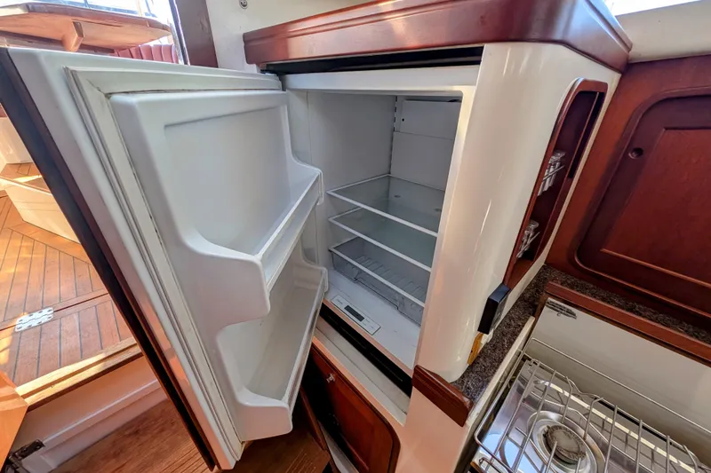Slide: The Image of Open refrigerator in 2000 Santa Cruz Coastal Flyer 41 yacht kitchen. - 44