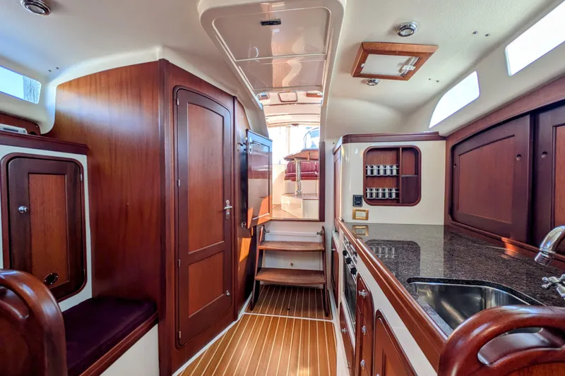 Slide: The Image of Interior of 2000 Santa Cruz Coastal Flyer 41 yacht with elegant wood finish. - 48