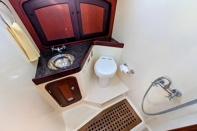 Slide: The Image of Luxurious bathroom in 2000 Santa Cruz Coastal Flyer 41 yacht with sink, toilet, and shower. - 52
