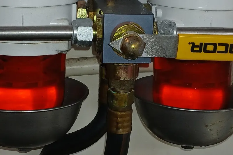 Slide: The Image of Close-up of a Santa Cruz Coastal Flyer 41 engine component, featuring red fuel filters. - 55