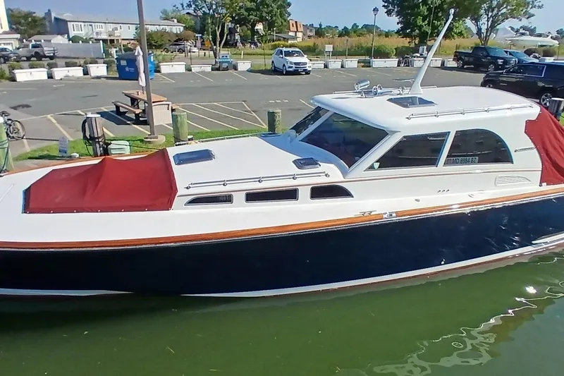 Slide: The Image of Santa Cruz Coastal Flyer 41 boat, 2000 model, docked with red covers, in a marina setting. - 6