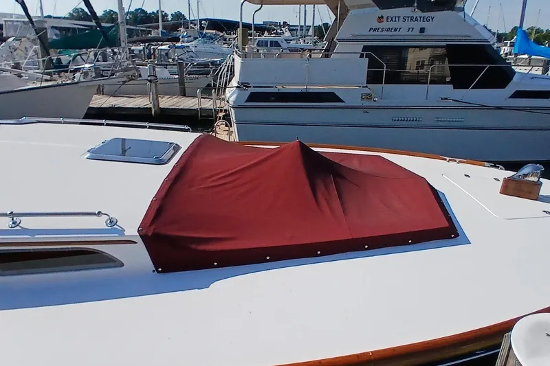 Slide: The Image of Santa Cruz Coastal Flyer 41, 2000 model, with maroon cover, docked at marina. - 7