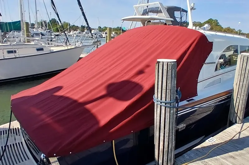 Slide: The Image of Santa Cruz Coastal Flyer 41 boat, 2000 model, docked with red cover, marina background. - 8