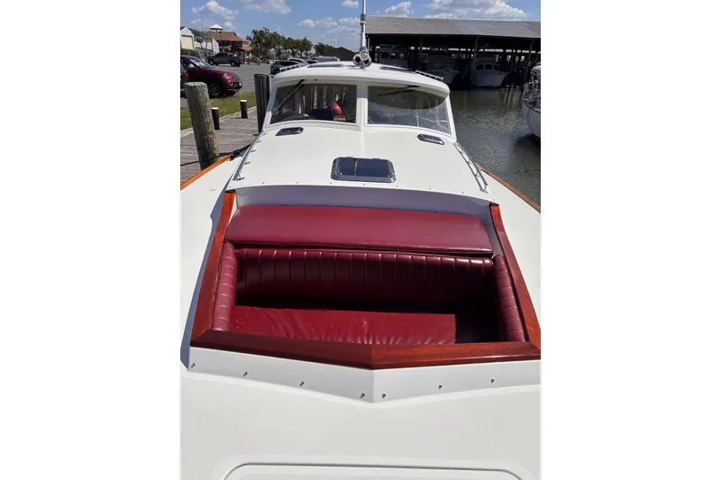 Slide: The Image of 2000 Santa Cruz Coastal Flyer 41 boat with red leather seating, docked at marina. - 9