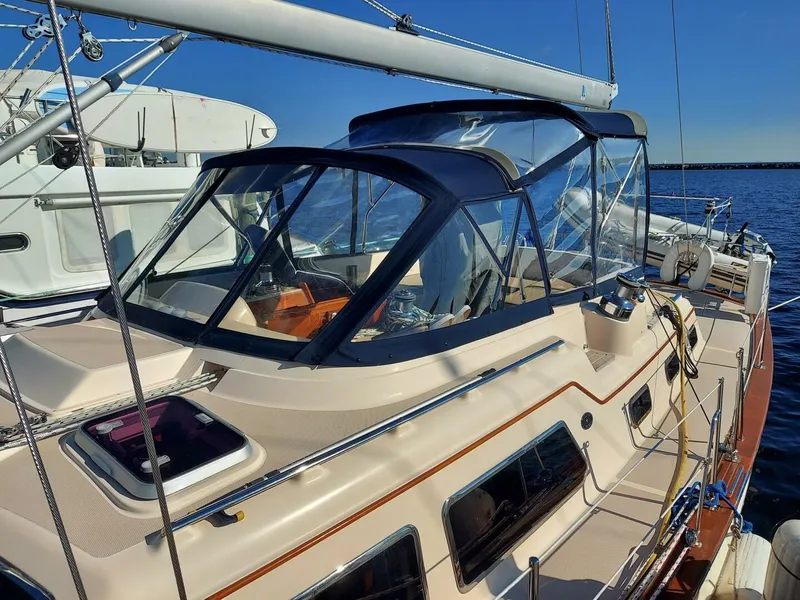 Slide: The Image of 2009 Island Packet 465 sailboat cruising on open water, aerial view. - 15