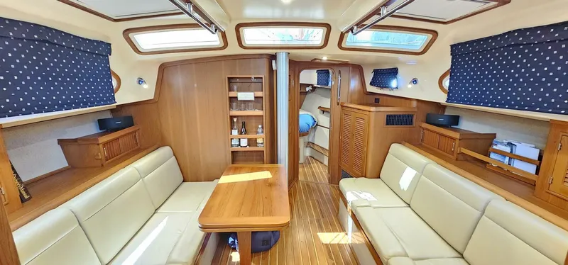 Slide: The Image of Interior of 2009 Island Packet 465 yacht with elegant wood finish and comfortable seating. - 2