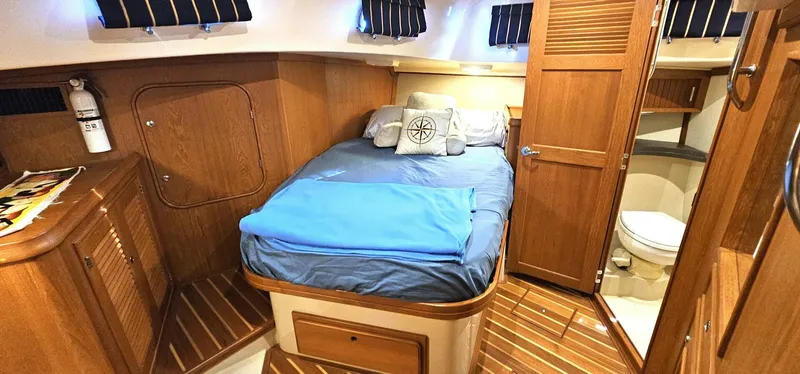Slide: The Image of Luxurious 2009 Island Packet 465 yacht cabin with cozy bed and ensuite bathroom. - 7