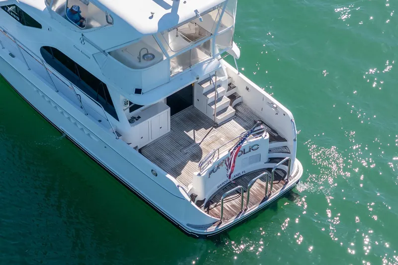 Slide: The Image of 2007 Ocean Alexander 52 Sedan yacht on clear green water, rear view. - 11