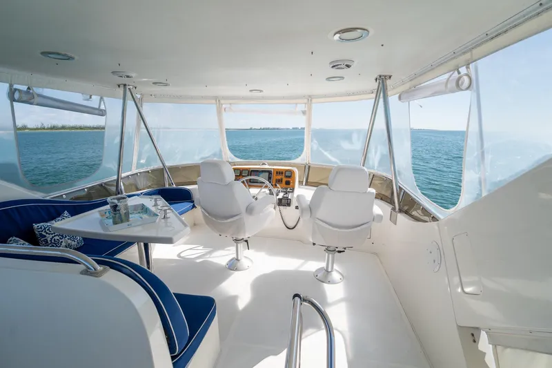 Slide: The Image of Luxurious 2007 Ocean Alexander 52 Sedan yacht interior with ocean view and elegant seating. - 14