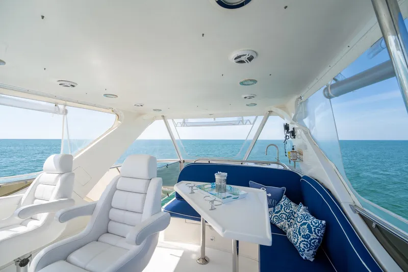 Slide: The Image of Luxurious 2007 Ocean Alexander 52 Sedan yacht interior with ocean view and plush seating. - 17