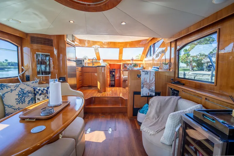 Slide: The Image of Luxurious interior of a 2007 Ocean Alexander 52 Sedan yacht, featuring elegant wood finishes. - 19