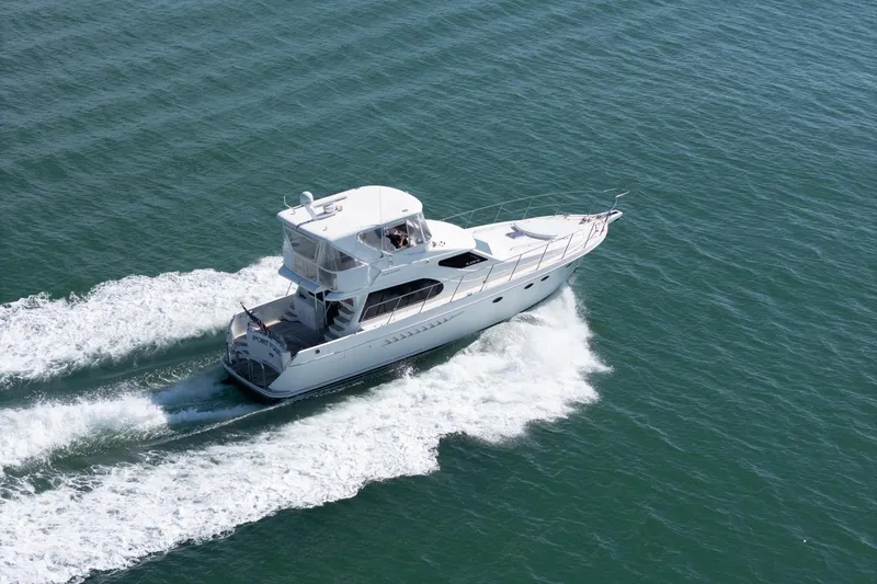 Slide: The Image of 2007 Ocean Alexander 52 Sedan yacht cruising on open water. - 2