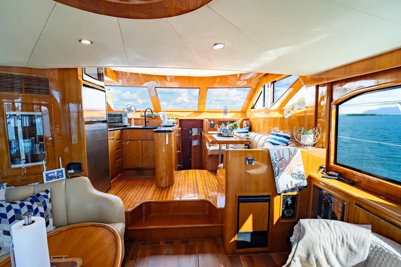 Slide: The Image of Luxurious interior of 2007 Ocean Alexander 52 Sedan yacht with elegant wood finishes and ocean view. - 22