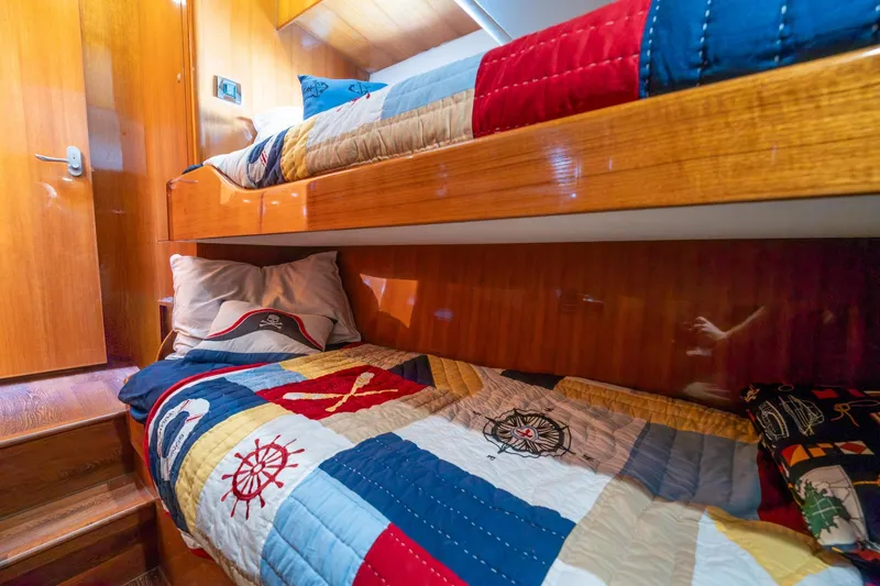 Slide: The Image of Bunk beds with nautical-themed quilts in 2007 Ocean Alexander 52 Sedan yacht cabin. - 25