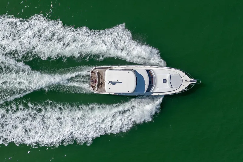 Slide: The Image of Aerial view of 2007 Ocean Alexander 52 Sedan yacht cruising on green water. - 3