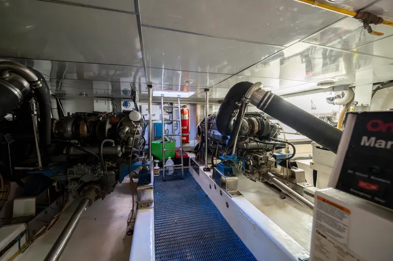 Slide: The Image of Engine room of 2007 Ocean Alexander 52 Sedan yacht, featuring dual engines and equipment. - 32
