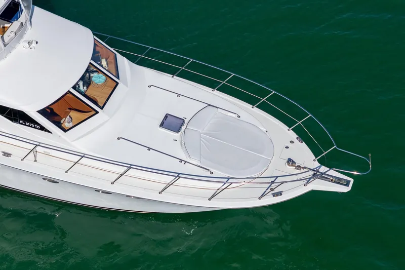 Slide: The Image of 2007 Ocean Alexander 52 Sedan yacht on calm green water, aerial view. - 9