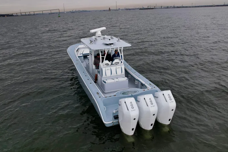 The Image of 2025 Yellowfin 36 Offshore boat with triple Mercury engines on open water. - 1