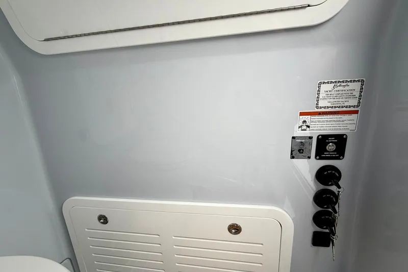 Slide: The Image of Interior view of 2025 Yellowfin 36 Offshore boat with certification and control panel. - 16