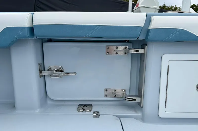 Slide: The Image of 2025 Yellowfin 36 Offshore boat seating and storage compartment detail. - 18