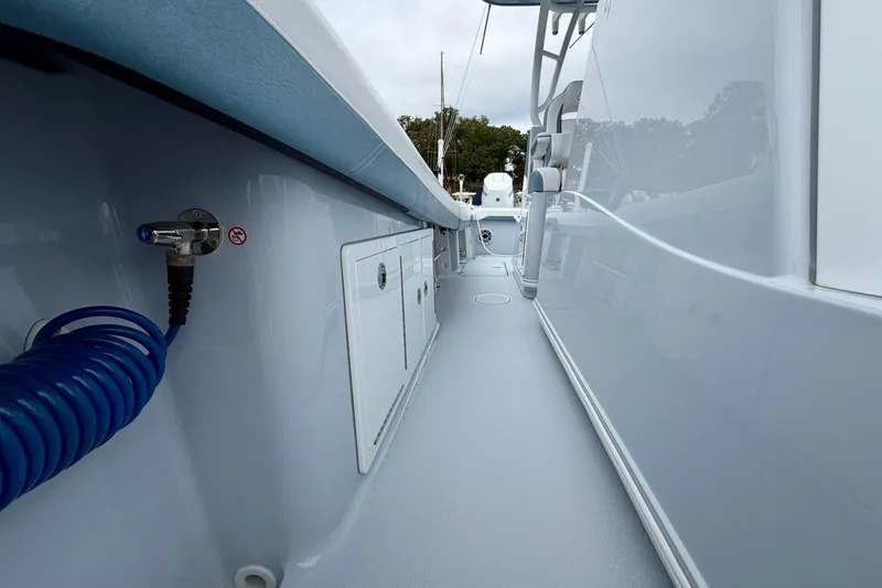 Slide: The Image of 2025 Yellowfin 36 Offshore boat interior with sleek design and storage compartments. - 24